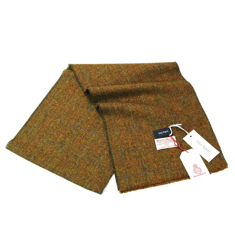 Draped scarf on tweed overcoat